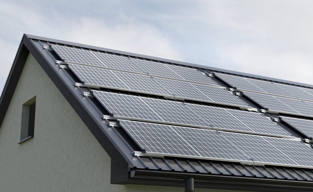 Solar modules mounted on a pitched metal roof using REKOSOL rail and clamp system